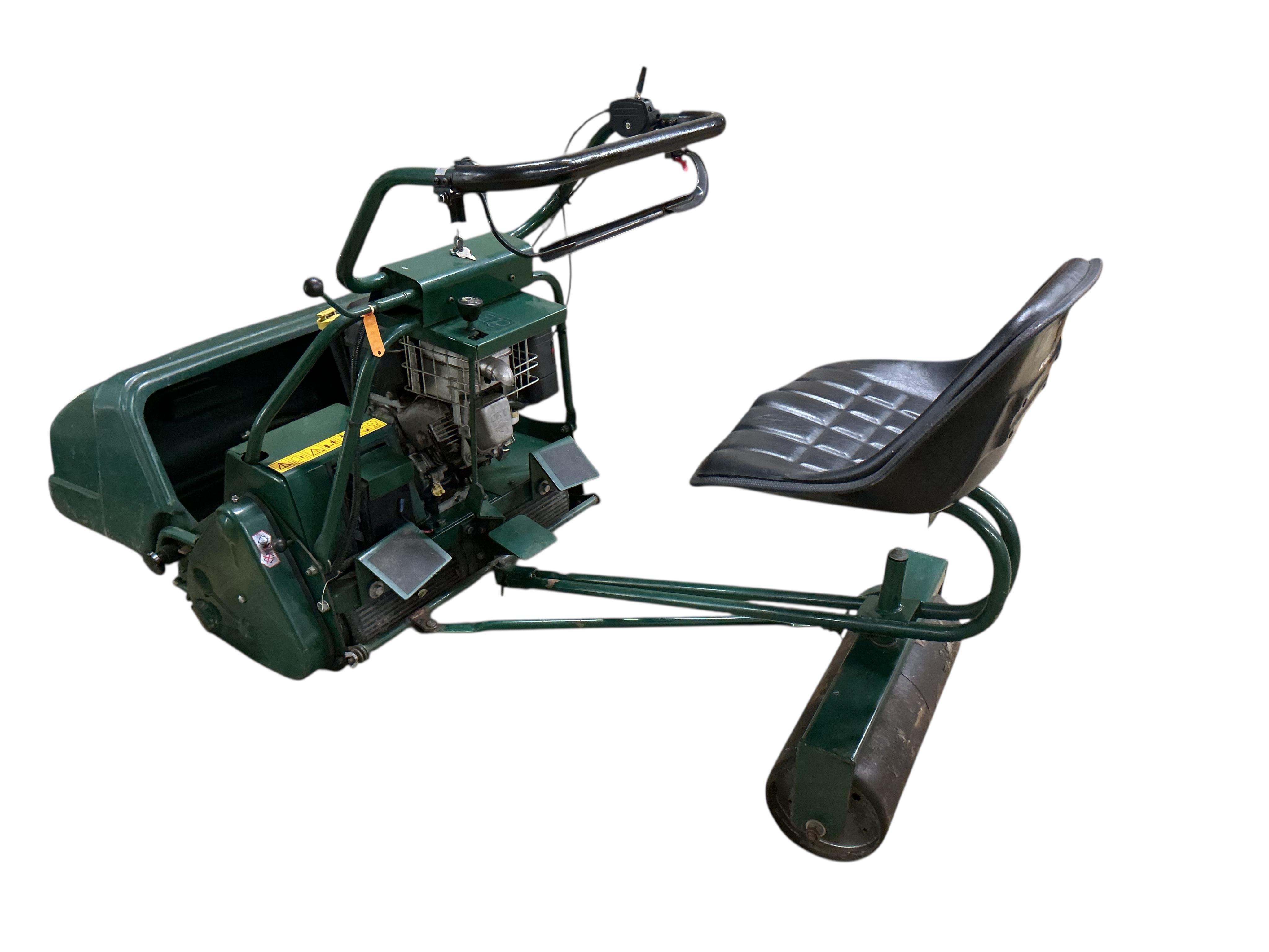 An Atco Royale 24E 6.5 HP 24inch ride on cylinder petrol mower. Serviced annually and in good working order with operating manuals